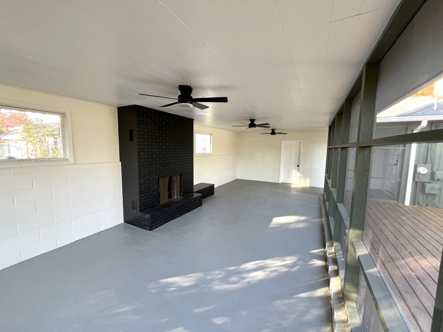 1630 Jonathan Avenue Rockford, IL 61103 - Photo 16 of 23 a big room with wooden floor fireplace and windows