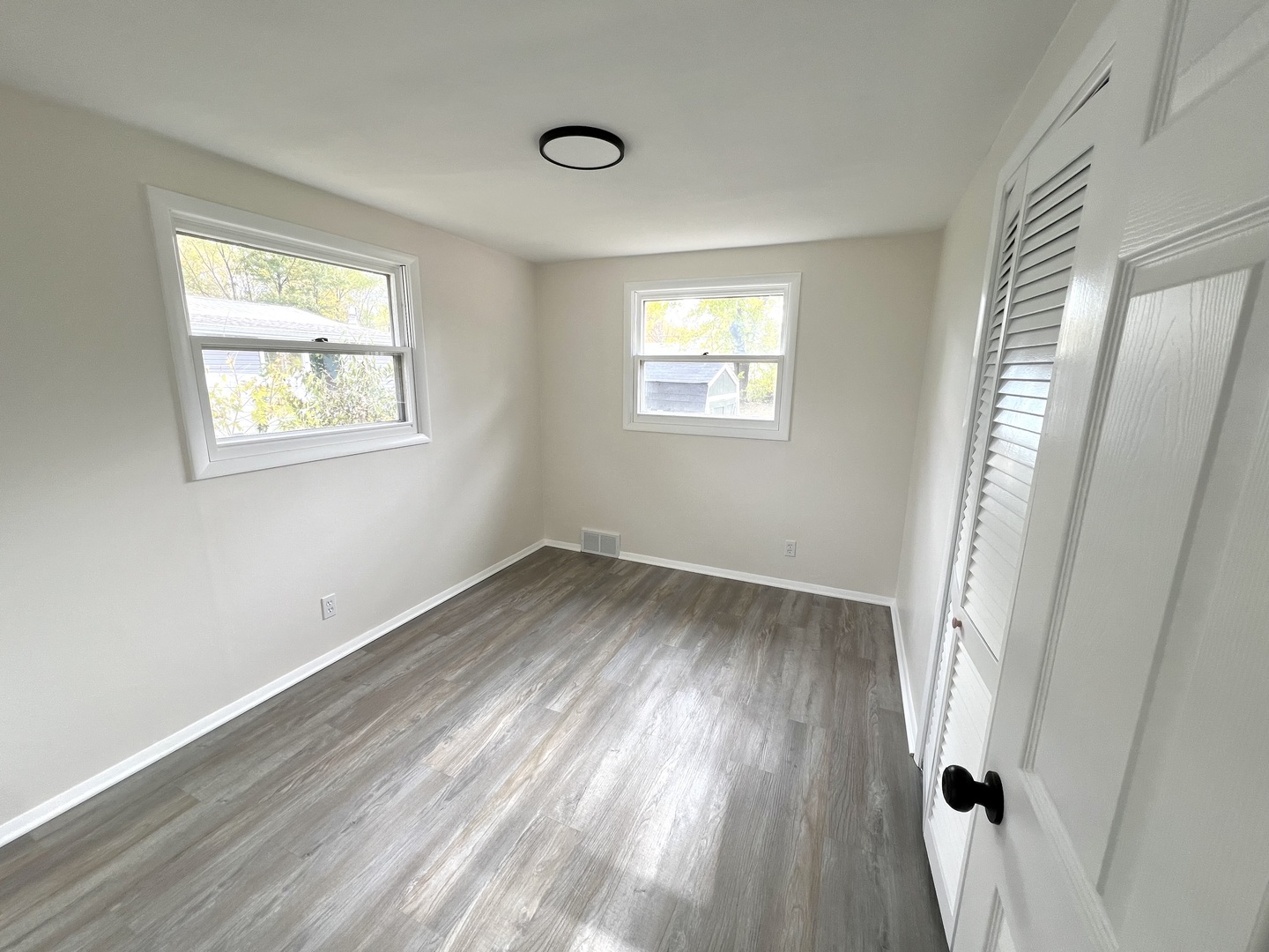 1630 Jonathan Avenue Rockford, IL 61103 - Photo 10 of 23 a view of empty room with wooden floor and fan