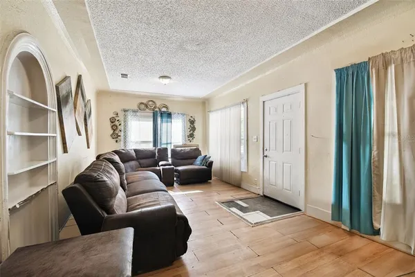 a living room with furniture and a window