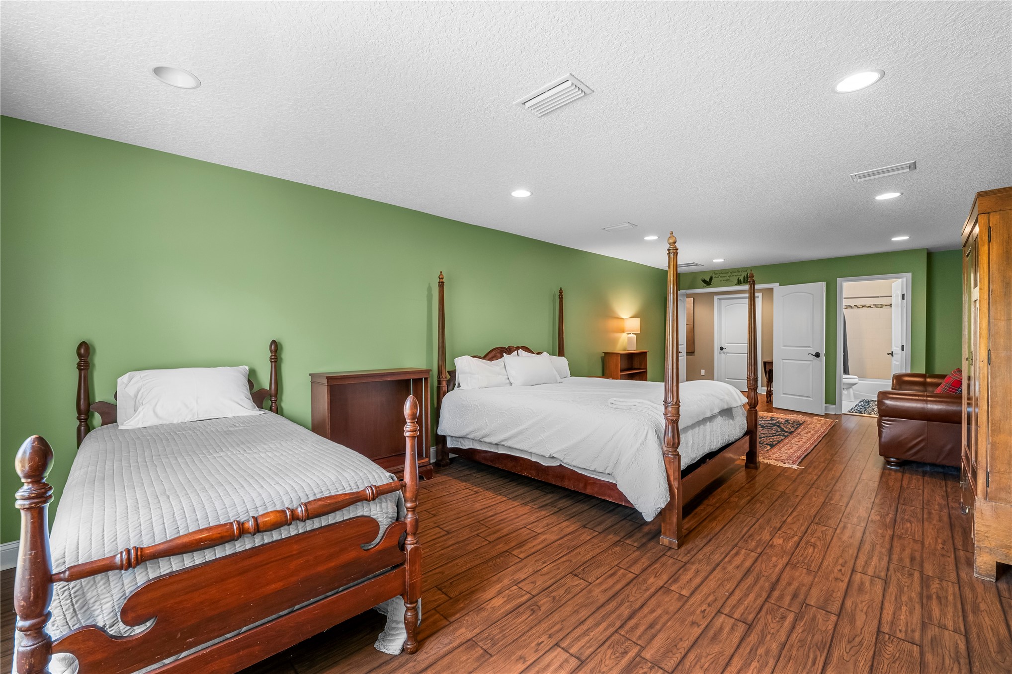 27247 Hallman Road Hilliard, FL 32046 - Photo 47 of 59 a bedroom with a bed and wooden floor