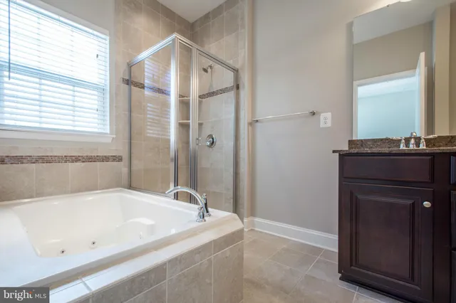 a bathroom with a bathtub and a sink