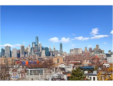 a view of a city with tall buildings