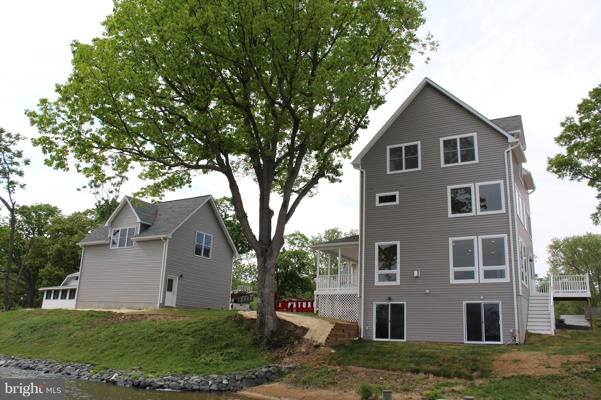 52 Johnson Road Pasadena, MD 21122 - Photo 6 of 30 from pier (basement w/2 slider & water view)