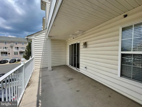 a view of a porch with wooden stairs