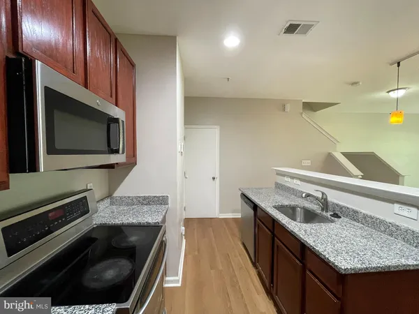 a kitchen with a stove and a microwave