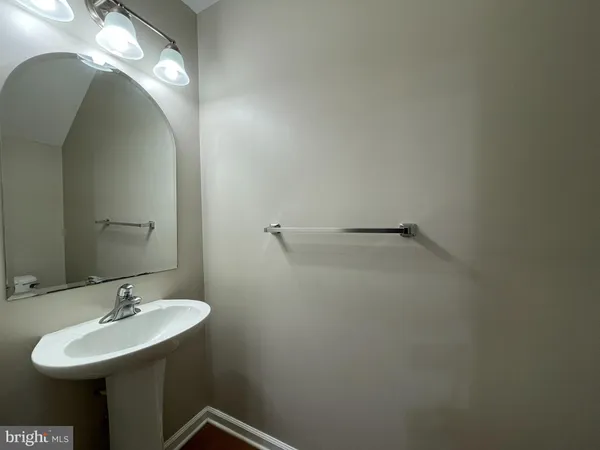 a bathroom with a sink and mirror