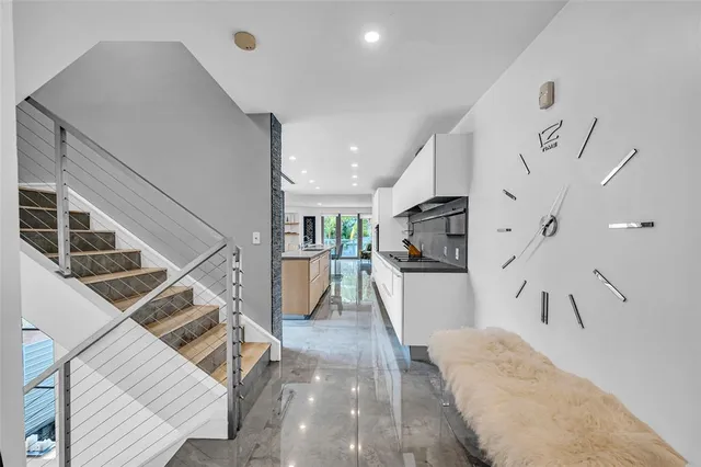 a view of entryway and kitchen