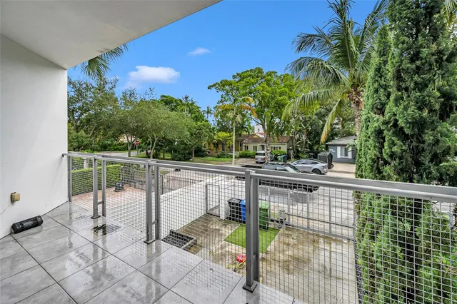 a view of a balcony with chairs