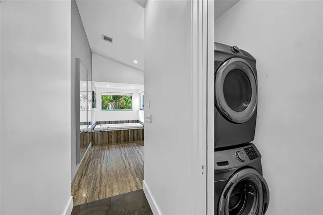 a view of a hallway with washer and dryer