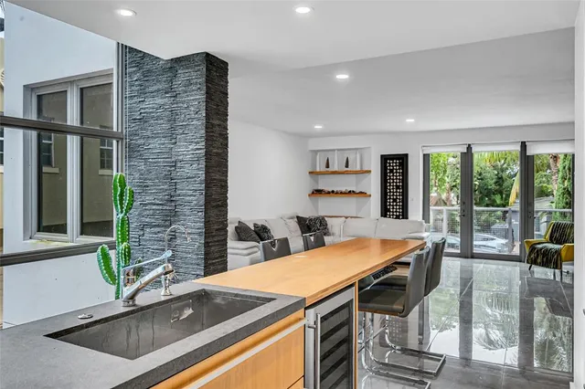 a view of a dining room with furniture window and outside view