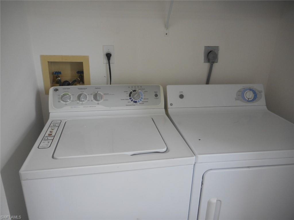 259 Quail Forest Boulevard, Unit 106 Naples, FL 34105 - Photo 19 of 23 a utility room with dryer and washer