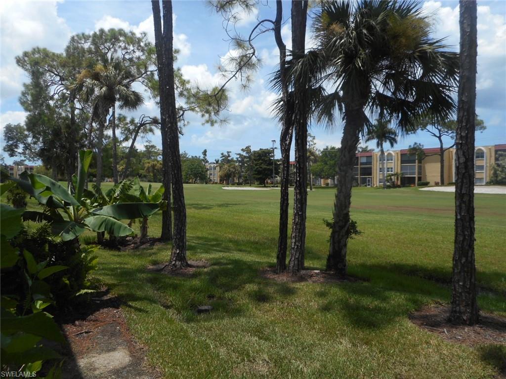 259 Quail Forest Boulevard, Unit 106 Naples, FL 34105 - Photo 2 of 23 a view of a park