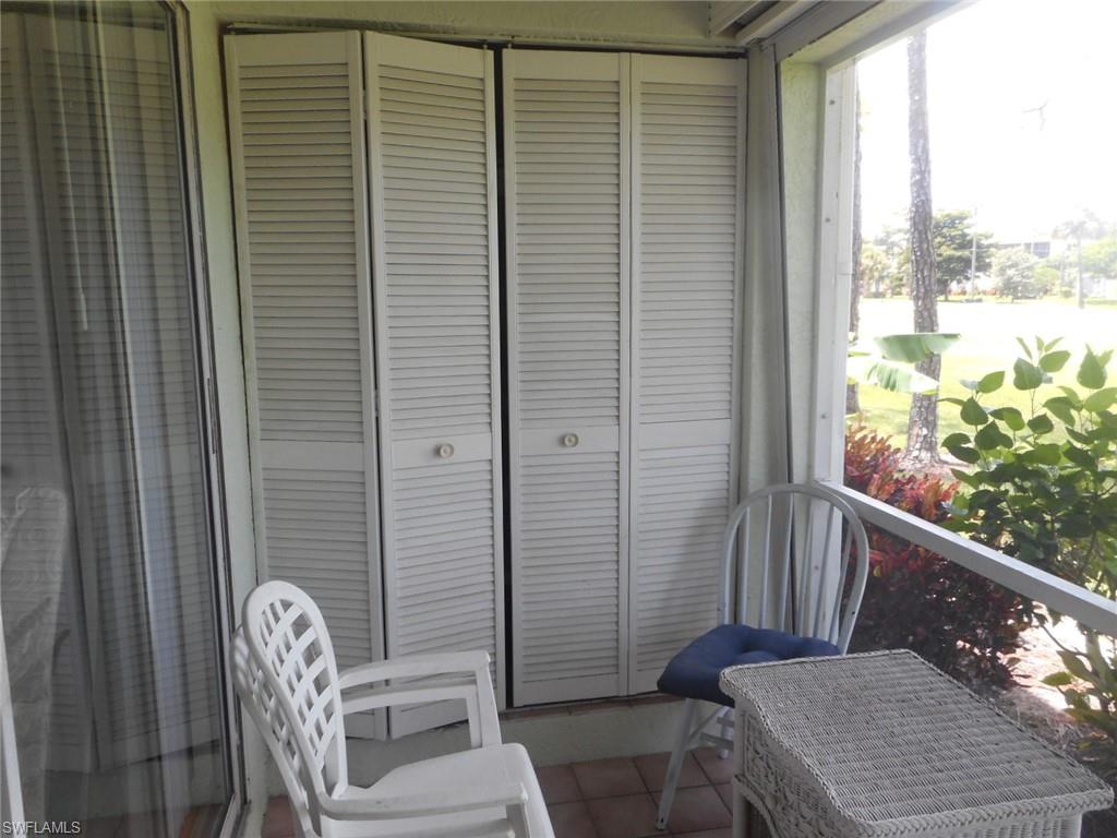 259 Quail Forest Boulevard, Unit 106 Naples, FL 34105 - Photo 4 of 23 a view of a balcony with chair