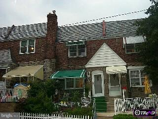 630 Briarcliff Road Upper Darby, PA 19082 - Photo 1 of 1 a front view of a house with a garden