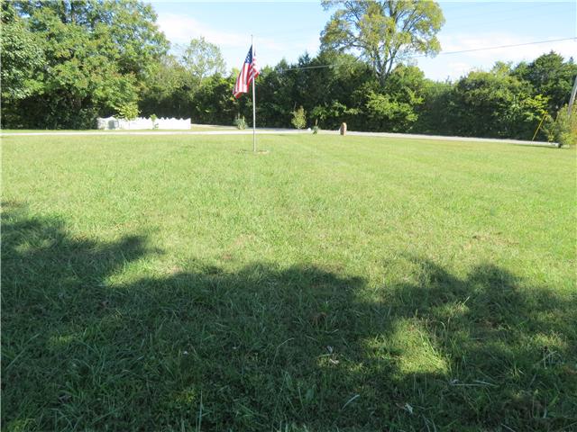 3270 Franklin Road Lebanon, TN 37090 - Photo 4 of 20 WONDERFUL FRONT YARD WITH A ROCK FISH POND AND THE AMERICAN FLAG