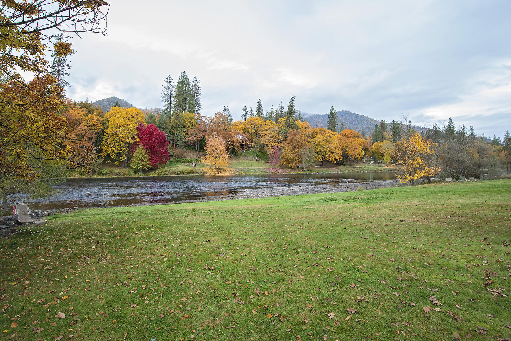 1665 Upper River Road Gold Hill, OR 97525 - Photo 2 of 48 a view of a field with an trees