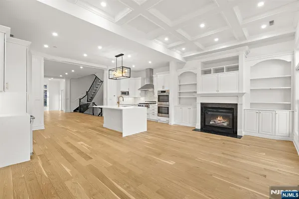 a view of kitchen with furniture and a fireplace