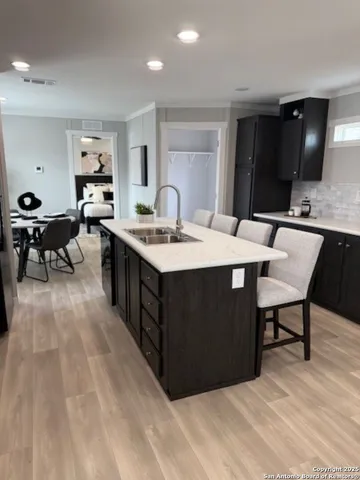 a large kitchen with a table and chairs in it