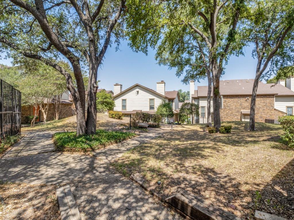 11311 Audelia Road, Unit 221 Dallas, TX 75243 - Photo 22 of 22 a view of house with outdoor space and tree s