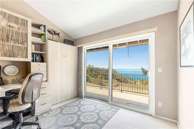 a view of an entryway with wooden floor and windows