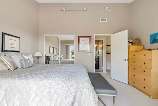 a bedroom with a bed and a walk in closet