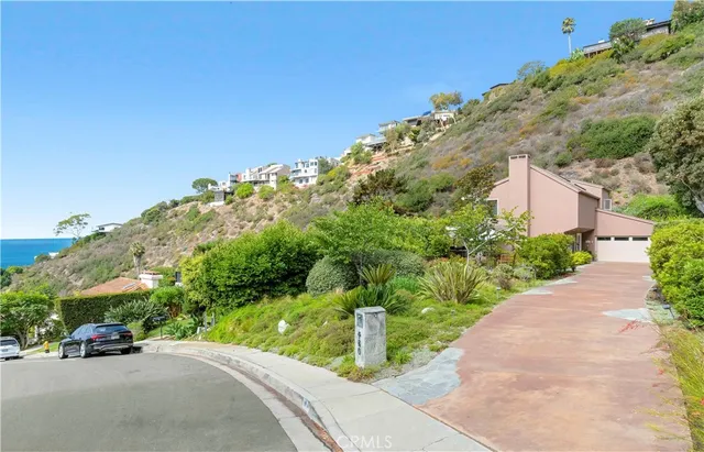 a dining room with furniture a large window and wooden floor