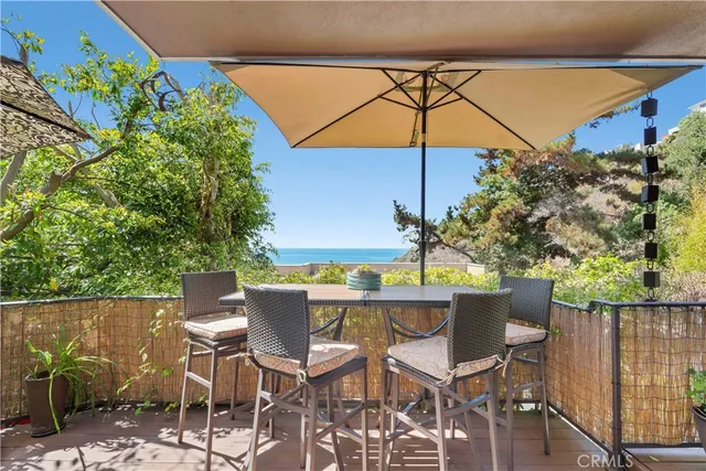 a patio with a patio table and chairs