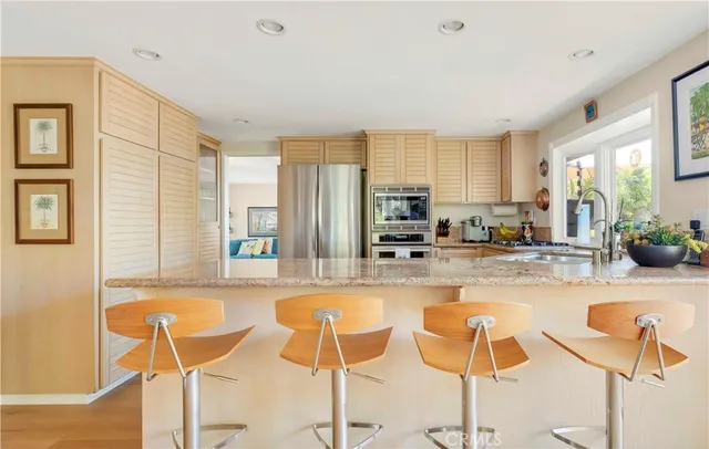a view of hallway with stairs and wooden floor