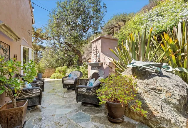 a view of a patio with couches and potted plants