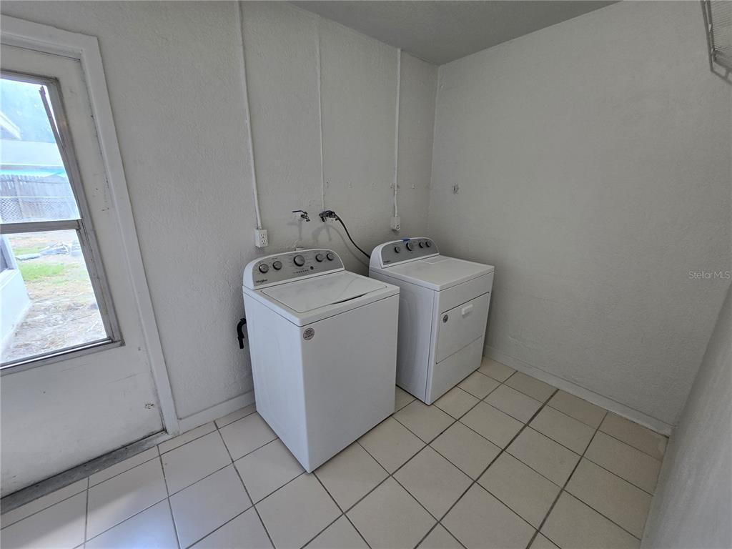 3406 Murrow Street New Port Richey, FL 34655 - Photo 17 of 21 a utility room with dryer and washer