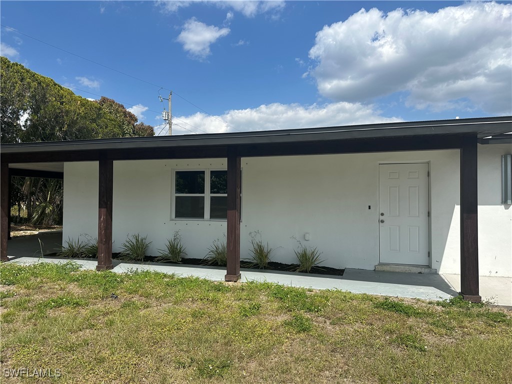 100 Wyoming Road Lehigh Acres, FL 33936 - Photo 1 of 38 a view of a backyard
