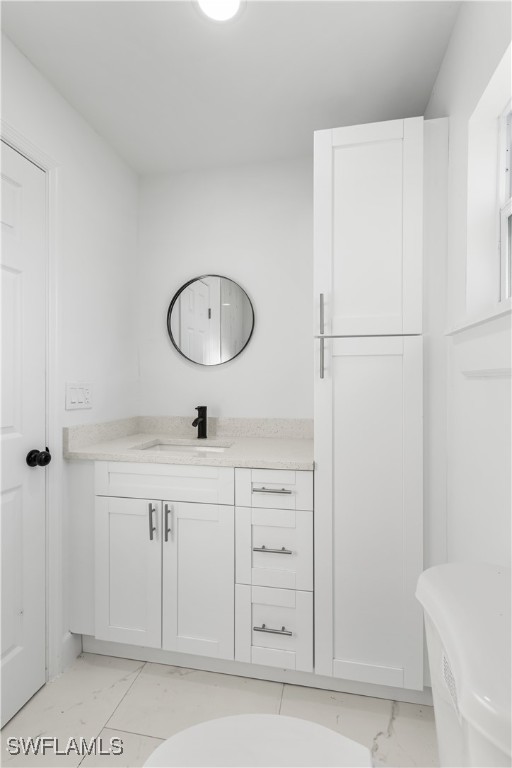 100 Wyoming Road Lehigh Acres, FL 33936 - Photo 15 of 38 a bathroom with a sink and a mirror