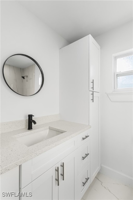 100 Wyoming Road Lehigh Acres, FL 33936 - Photo 17 of 38 a bathroom with a sink and a mirror