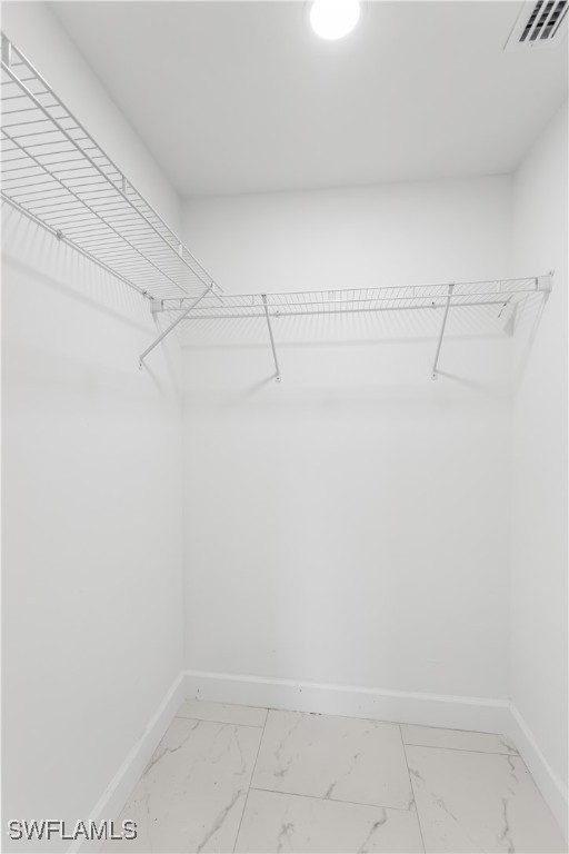 100 Wyoming Road Lehigh Acres, FL 33936 - Photo 19 of 38 a view of a room with racks on the wall