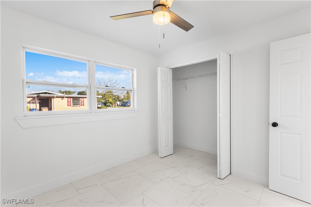 100 Wyoming Road Lehigh Acres, FL 33936 - Photo 23 of 38 a view of an empty room with a window