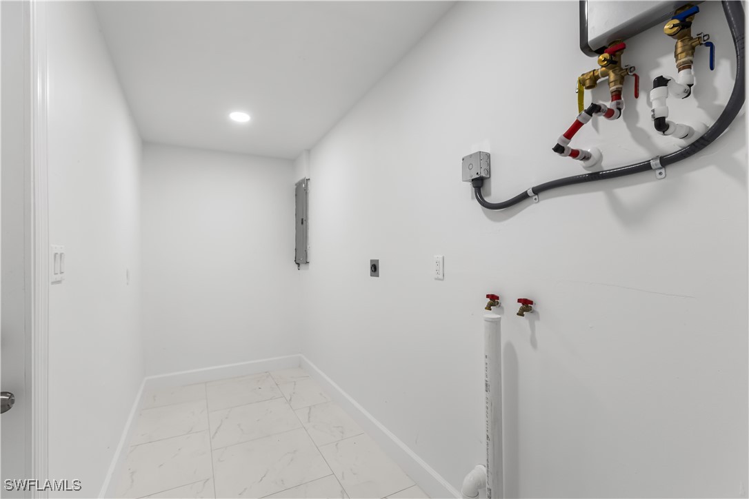 100 Wyoming Road Lehigh Acres, FL 33936 - Photo 28 of 38 a bathroom with a shower