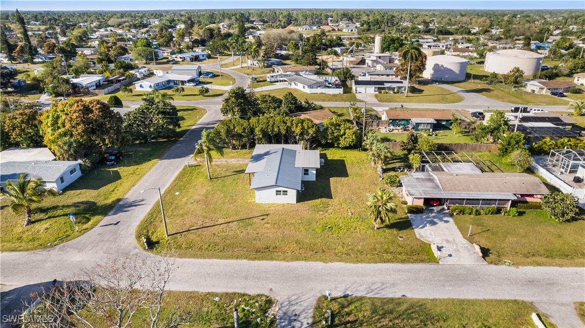100 Wyoming Road Lehigh Acres, FL 33936 - Photo 29 of 38 an aerial view of residential houses with outdoor space