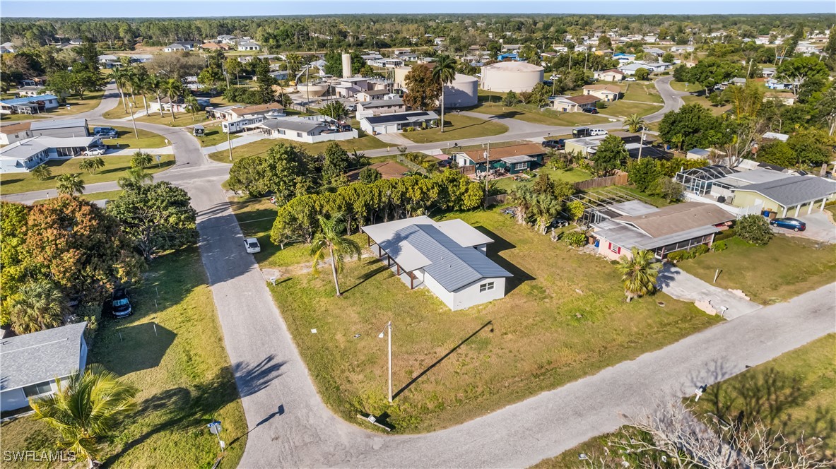 100 Wyoming Road Lehigh Acres, FL 33936 - Photo 31 of 38 an aerial view of residential houses with outdoor space