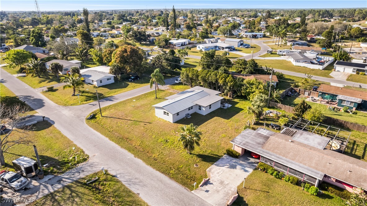 100 Wyoming Road Lehigh Acres, FL 33936 - Photo 37 of 38 an aerial view of residential houses with outdoor space