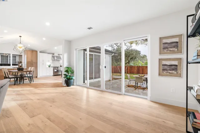 a view of a livingroom with furniture water view and a large window
