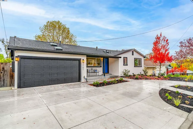 a view of a house with entertaining space and a garage
