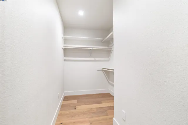 a white bath tub sitting in a bathroom next to a window