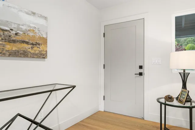 a view of a room with wooden floor and small staircase