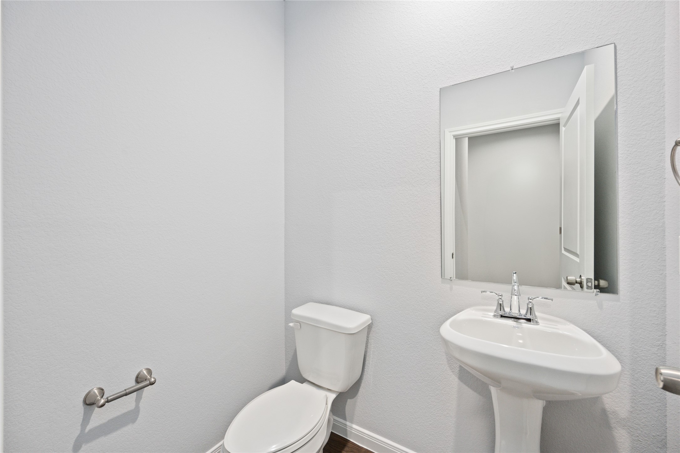 18831 Luminescent Ln Spring Spring, TX 77379 - Photo 10 of 36 a bathroom with a toilet a sink and mirror