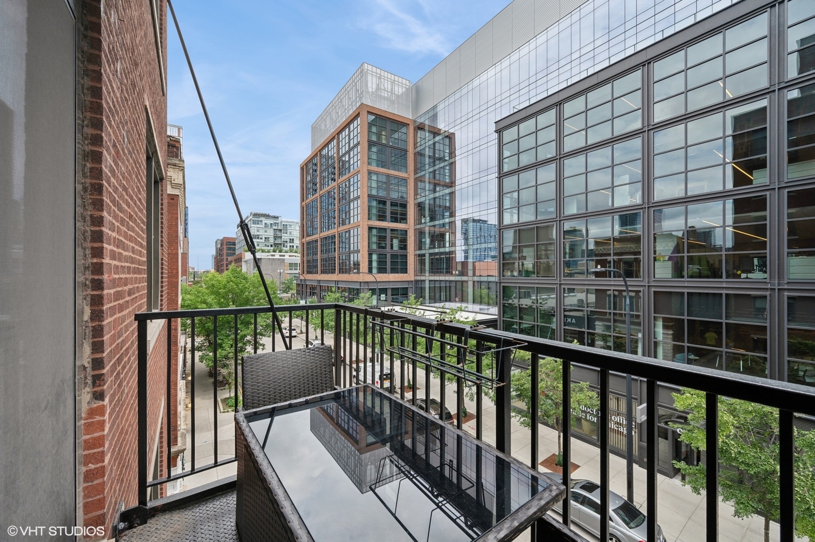 106 North Aberdeen Street, Unit 3A Chicago, IL 60607 - Photo 12 of 13 a view of balcony with a large window and wooden fence
