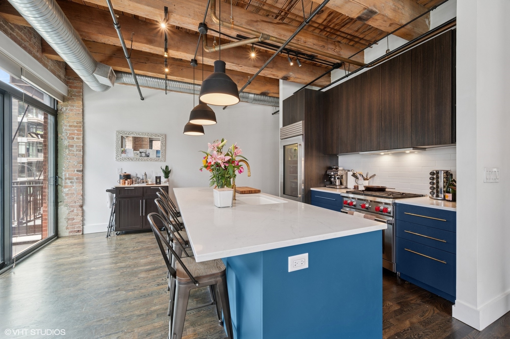 106 North Aberdeen Street, Unit 3A Chicago, IL 60607 - Photo 5 of 13 a kitchen that has a table and chairs in it
