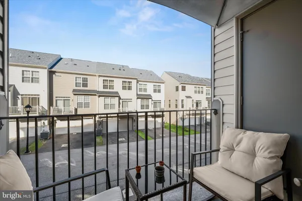 a view of a balcony with furniture