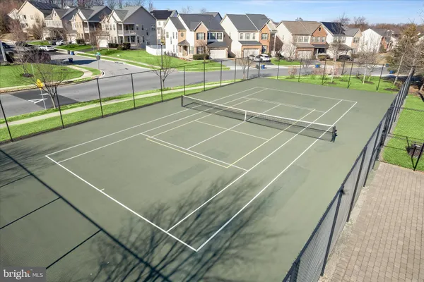 a view of an outdoor space and tennis court