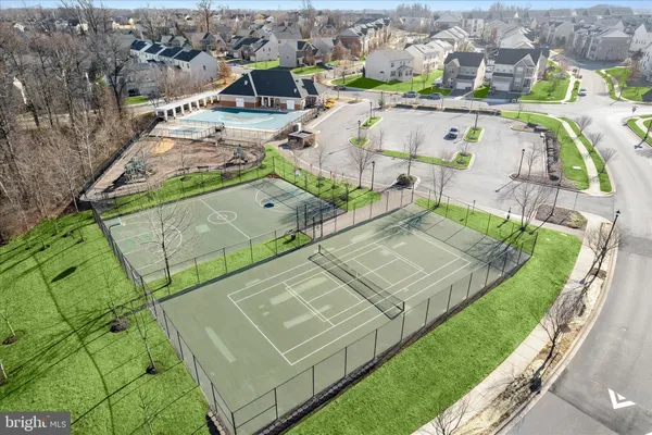 an aerial view of residential houses with outdoor space