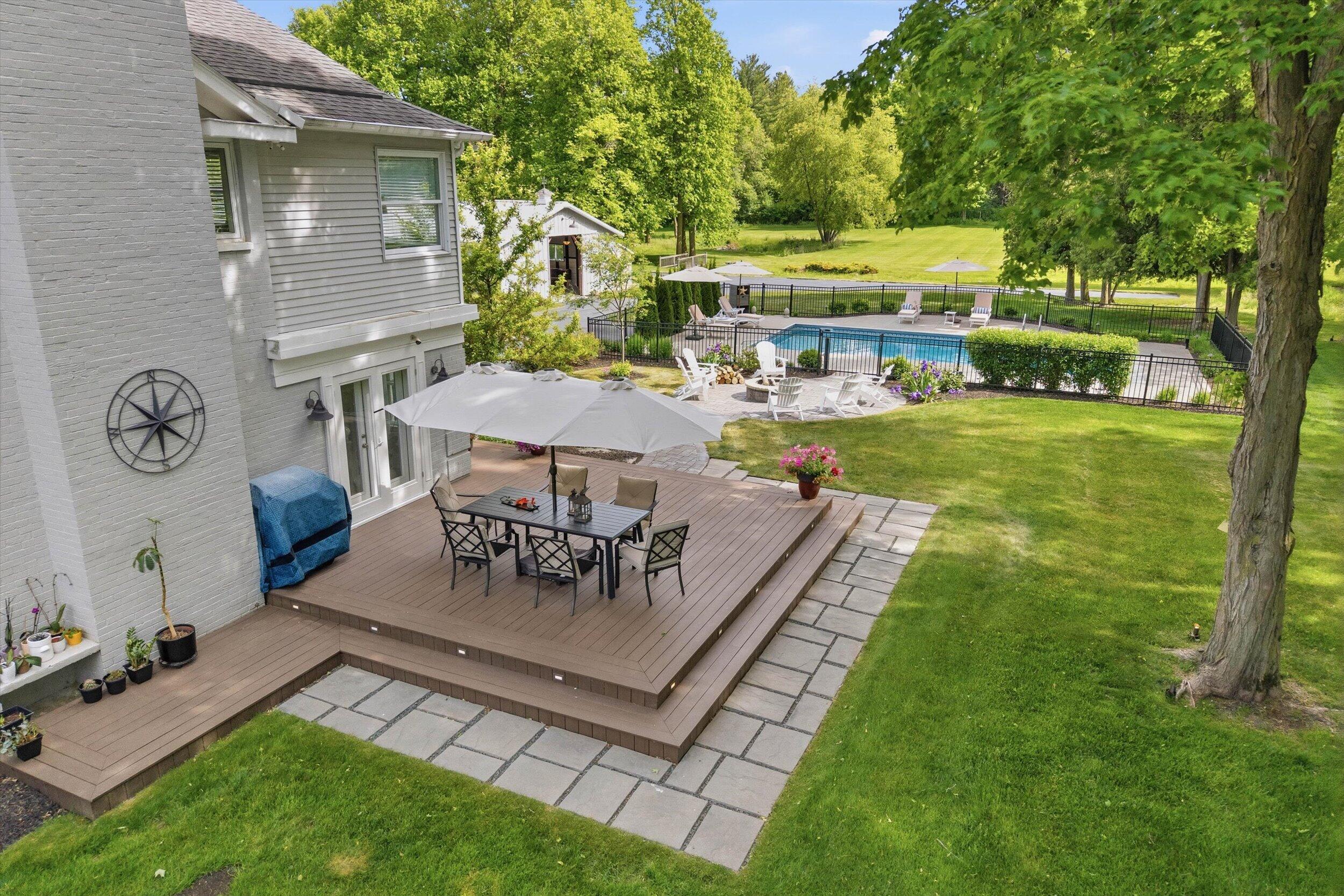 9431 Hawthorne Road Mequon, WI 53097 - Photo 42 of 67 Side patio w/view to pool